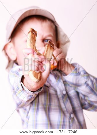 Young Boy Use Sling Shot Shoot Mandarine.