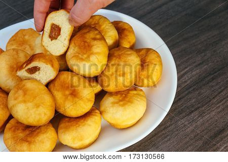German Donuts - Berliner With Jam And Icing Sugar In A Tray On A Dark Wooden Background.