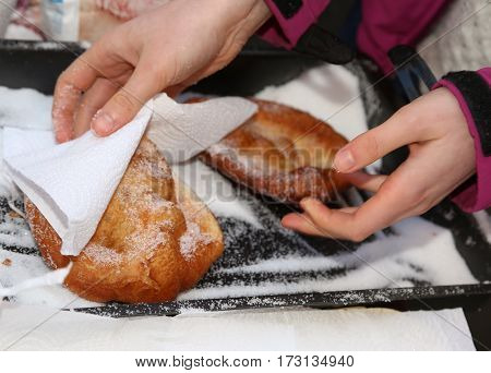 Hand Of The Young Girl Puts Sugar Over The Pancake In The Stall