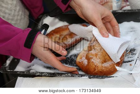 Hand Of The Young Girl Puts Sugar Over The Pancake