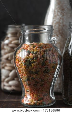 Lentils, rice in glass jars healthy food vertical