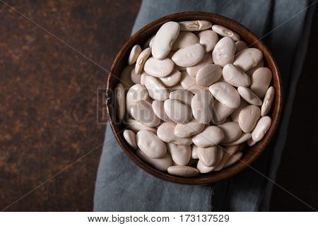 Large white beans in a wooden bowl horizontal