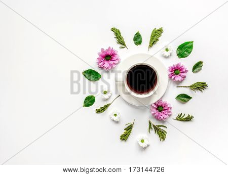Froral flat lay with cup of coffee on white background top view mockup