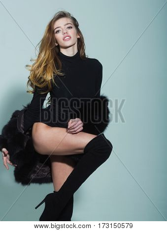 Pretty Sexy Woman With Long Hair In Fur And Jackboot