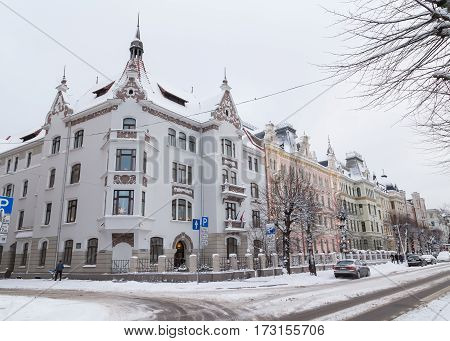 RIGA LATVIA - 3RD JAN 2017: Snowy streets in Riga during the day in the winter. The outside of buildings can be seen.