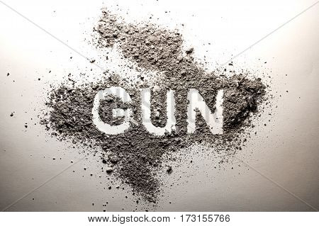 Gun word written in ash as crime criminal violence murder death danger kill protection safety concept