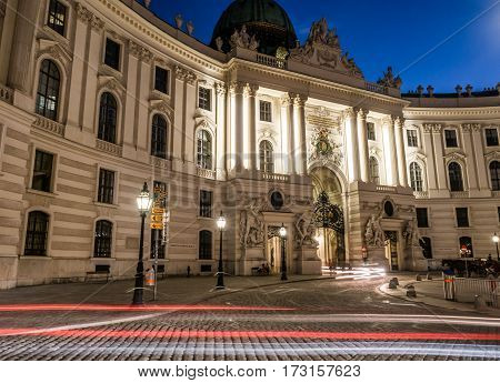 VIENNA AUSTRIA - 23RD AUGUST 2016: The exterior of the Hofburg Palace in Vienna from Michaelerplatz at night.