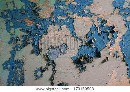 Wall with old paint in the shape of a world map