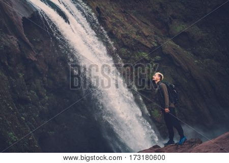 Cheerful adventurer near Ouzoud waterfall in Morocco.