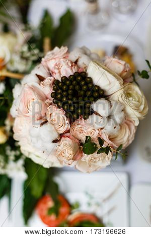 Beautiful Winter Wedding Bouquet With Cones, Cotton And Spruce Branches. Bride Holding A Bridal Bouq