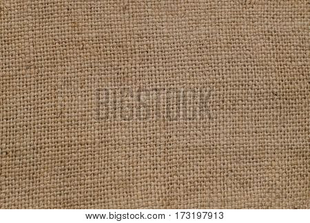 Old canvas from rough dark threads, a sacking, a background