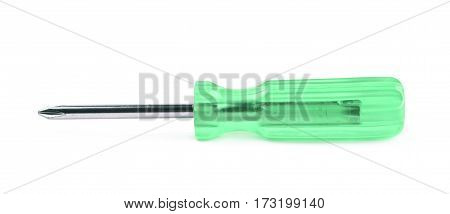 Tiny crosshead screwdriver with a plastic green handle, isolated over the white background
