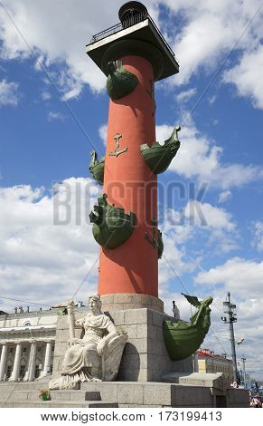 South Rostral column closeup of a cloud on a summer day. Saint Petersburg
