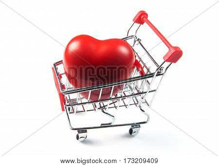 Big heart gift in shopping cart isolated on white background