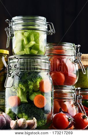 Jars With Marinated Food And Organic Raw Vegetables