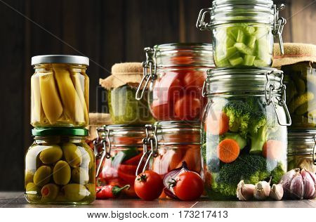 Jars With Marinated Food And Organic Raw Vegetables