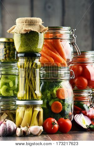 Jars With Marinated Food And Organic Raw Vegetables