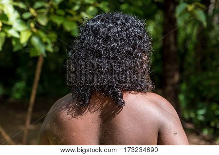 Vedda man walking in jungle. Veddas are an indigenous people of Sri Lanka living in tribes in the jungle