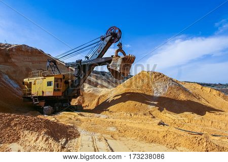 Sand quarry near the town of Orikhiv in Zaporizhzhia region of Ukraine. Excavator  electric power shovel 
 with bucket capacity of five cubic meters. September 2006