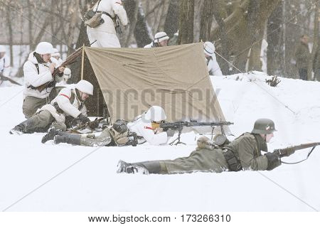 The park Ekaterinhof St. Petersburg (Russia) - February 23 2017: Military historical reconstruction of events of World War II.
German machine gunner armed with a machine gun
MG 42 in the subdivision reflects the attack.