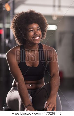 young fit african american woman doing sit ups in fitness studio at the gym.Abdominal exercises Sit up
