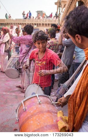 Nandgaon, India - March 17, 2016: Devotees celebrate Lathmar Holi in Nandgaon village, Uttar Pradesh, India.