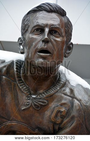MONTREAL-CANADA 02 15 2017: Statue of Jean Beliveau former hockey player in front the Bell Center. He was inducted into the Hockey Hall of Fame in 1972.