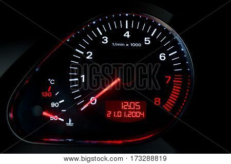 tachometer on a car dashboard closeup shot