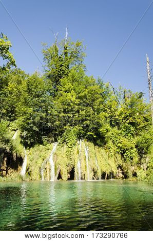 landscape of plitvicka national lake park at sunset unesco heritage site plitvice croatia.