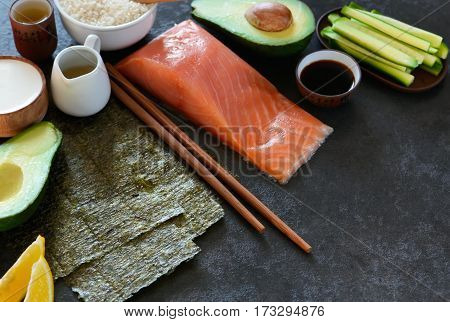 Ingredients for the preparation of rolls and sushi on a black background. food background