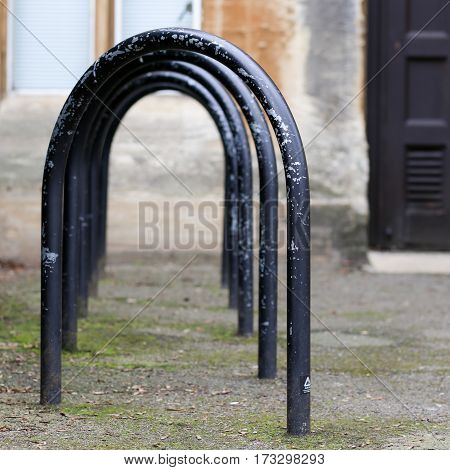 Jowett Walk Oxford United Kingdom February 19 2017: Empty black painted bicycle parking metal frames on the street in Oxford England