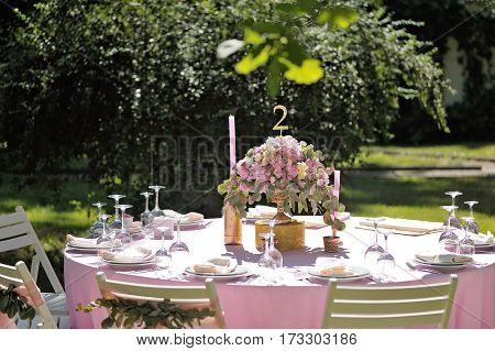 Wedding Guest Numbered Table, Decorated With Bouquet And Cloth, In Pink Colours