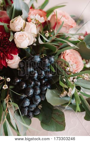 Autumnal Wedding Bouquet Of Roses, Apples, Grape And Pomergranate, In Red Colour, Closeup