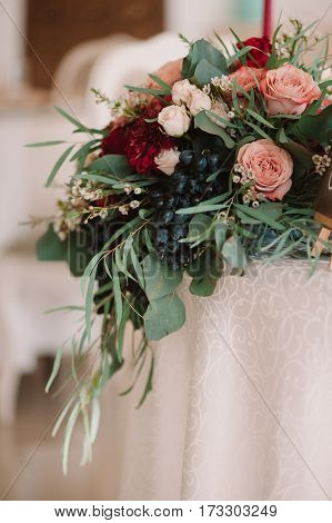 Autumnal Wedding Bouquet Of Roses, Apples, Grape And Pomergranate, In Red Colour, Closeup