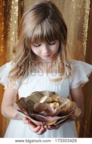 Young Girl With Golden Rose, In White Tenderless Dress On Golden Background