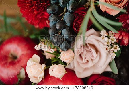 Autumnal Wedding Bouquet Of Roses, Apples, Grape And Pomergranate, In Red Colour, Closeup