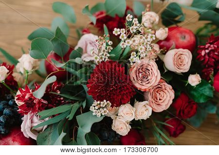 Autumnal Wedding Bouquet Of Roses, Apples, Grape And Pomergranate, In Red Colour, Closeup