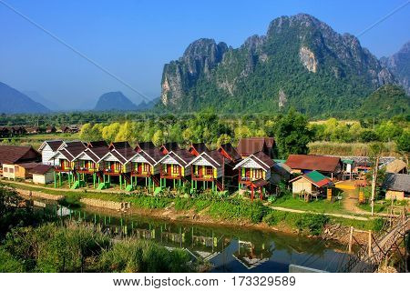 Row Of Tourist Bungalows Along Nam Song River In Vang Vieng, Vientiane Province, Laos