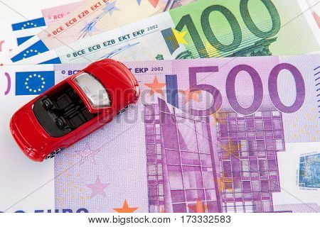 Toy car on euro notes