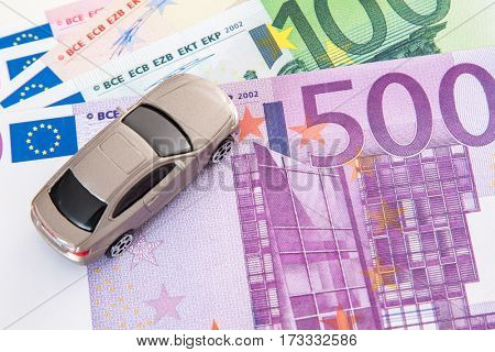 Toy car on euro notes
