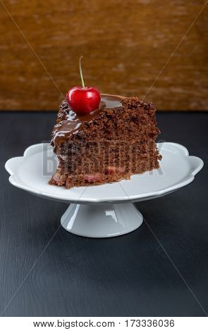 Chocolate cake with juicy cherries