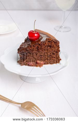 Chocolate cake with juicy cherries