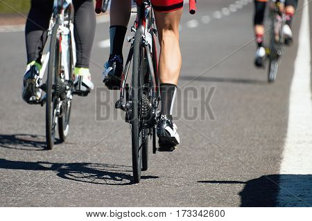 Cycling race competition on the asphalt road, view from behind