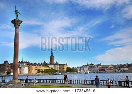 STOCKHOLM SWEDEN - AUGUST 20 2016: Tourists walk and visit Stockholm City Hall ( Stadshuset ) and View of Gamla Stan in Stockholm Sweden on August 20 2016.