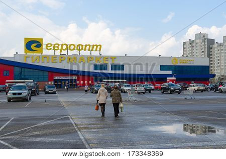 GOMEL BELARUS - APRIL 14 2016: Unidentified people go to supermarket Euroopt on Street Khatayevich Gomel Belarus