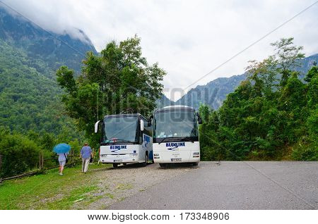 KOLASIN MONTENEGRO - SEPTEMBER 20 2015: Unidentified people go to sightseeing buses in mountainous area Kolasin Montenegro