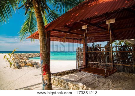 Wooden Teeterboard At Tropical Beach Island Under Palm Tree