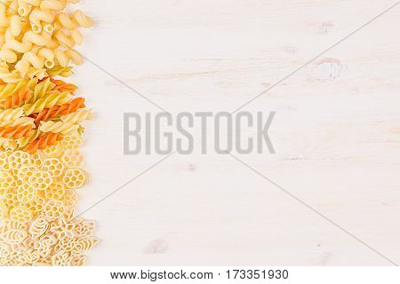 Pasta background decorative border of assortment different kinds italian macaroni. Healthy traditional food backdrop.
