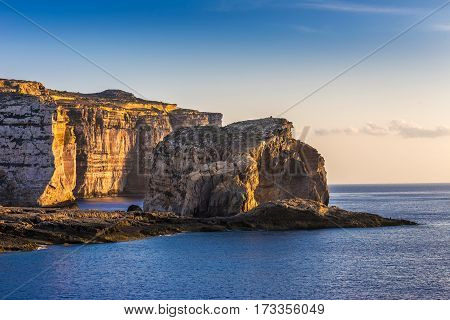 Gozo Malta - The famous Fungus rock on the island of Gozo at Dwejra bay at sunset