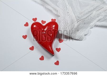 Red heart and sexy white lingerie - White sexy lingerie and red heart with small hearts.